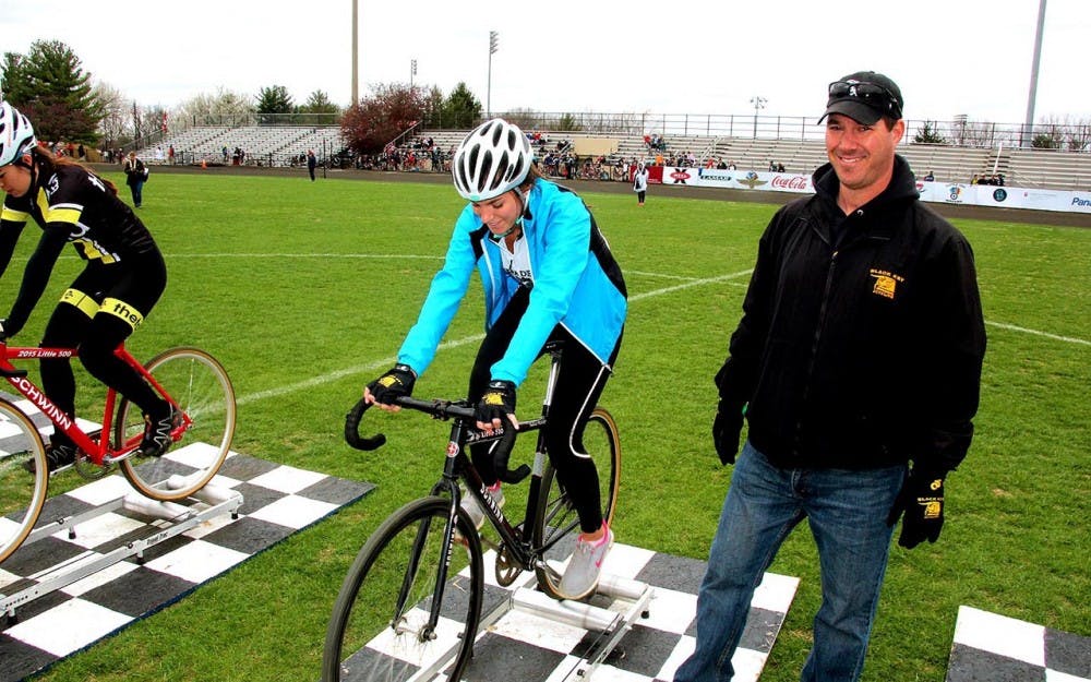 Freshman Kappa Delta rider Claire Choinacky warms up for this year's Miss N Out with her father, David, standing beside her.&nbsp;