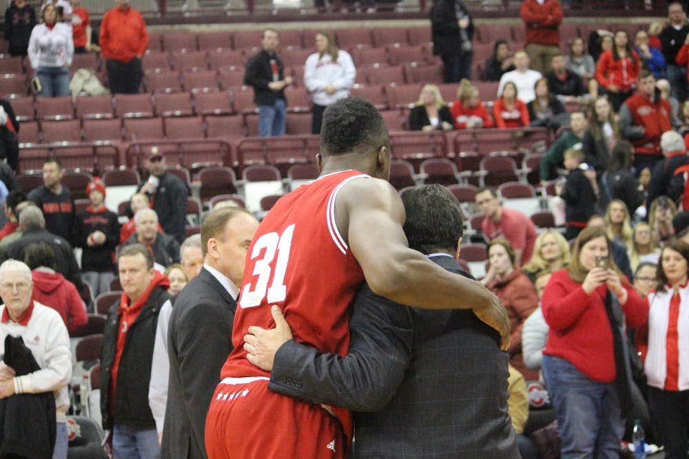 Sophomore center Thomas Bryant and IU Coach Tom Crean walk off the court together after the victory against Ohio State. Bryant, along with junior guard James Blackmon Jr., were named third team all-Big Ten on Monday.