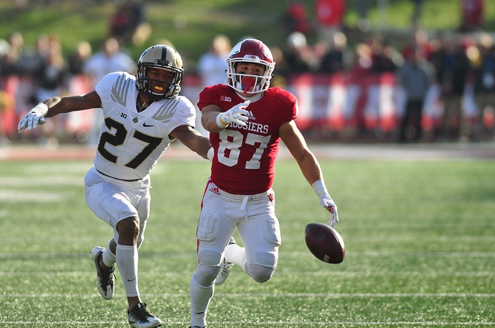 Senior wide receiver Mitchell Paige reaches for a pass from Richard Lagow in the fourth quarter at Memorial Stadium on Saturday. IU defeated Purdue 