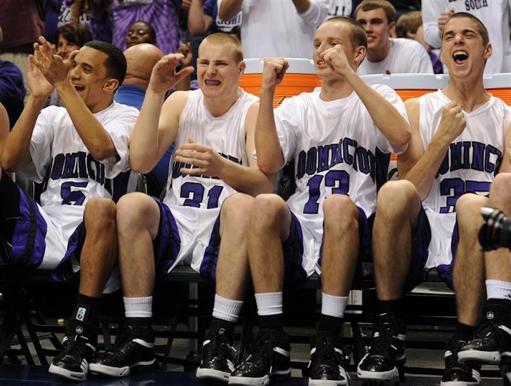 Bloomington South players, from left, Rickey Washington, Marcus Etnier, Brandon French and Curtis Payton react to a late basket in their 69-62 win over Fort Wayne Snider in the IHSAA Class 4A boys basketball state finals action at Conseco Fieldhouse on Saturday in Indianapolis.