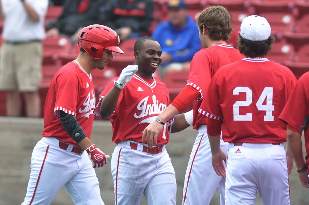 Then-freshman infielder Jeremy Houston, now a sophomore, is congratulated after returning to the Hoosier dugout after his first career home run on April 29. IU defeated No. 20 South Alabama 8-4 Sunday afternoon.