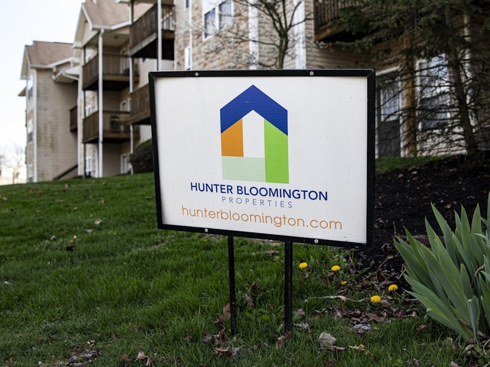 A Hunter Bloomington Properties sign stands in the grass April 6 outside Bloom Apartments. ﻿Hunter Bloomington Properties removed washers, dryers and other appliances Monday from three apartments in Bloomington where tenants have been unable or refused to pay rent.