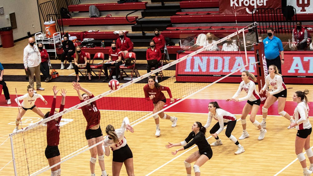 Then-freshman outside hitter Ashley Zuluaf spikes the ball against Wisconsin on Feb. 13, 2021, in Wilkinson Hall. Indiana went 1-1 in a trip to the East Coast over the weekend.