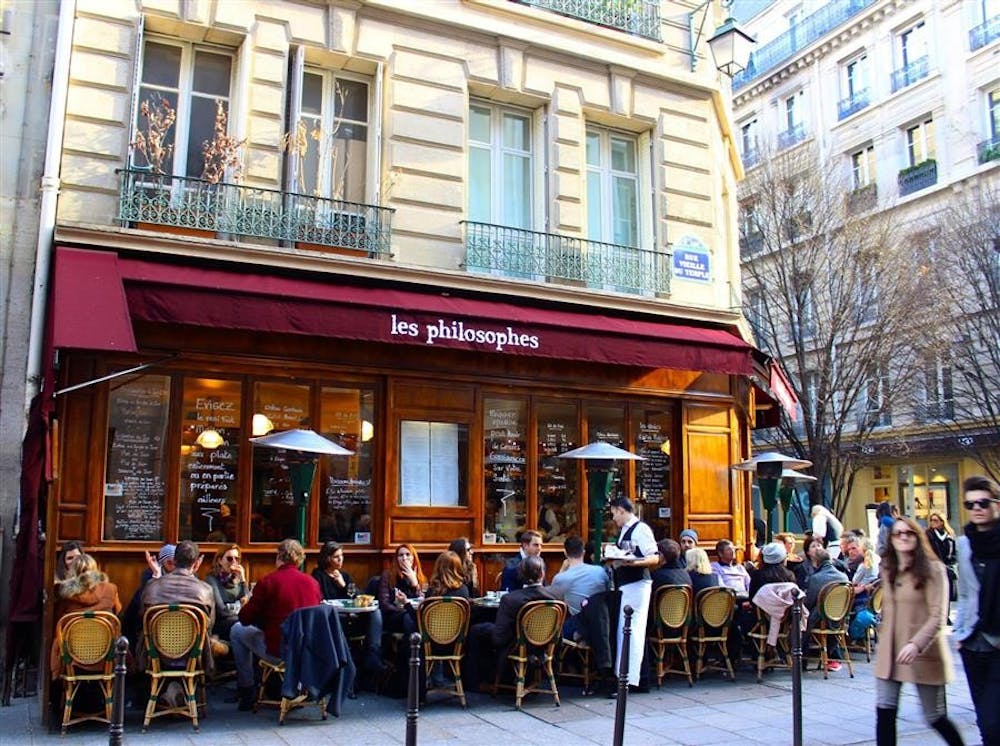 While most of the city is sleeping, Paris's Marais district bustles with people on a Sunday afternoon. 