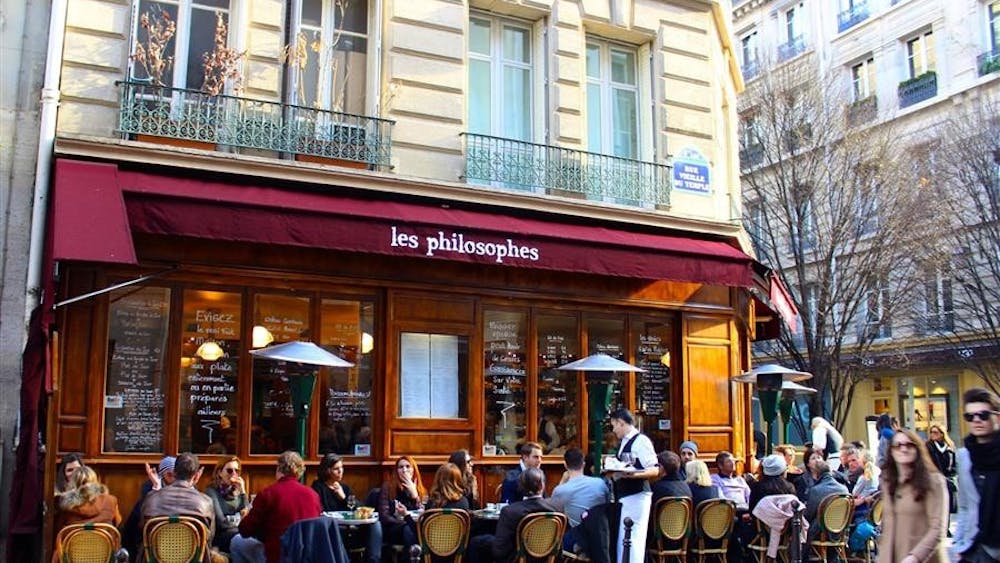 While most of the city is sleeping, Paris's Marais district bustles with people on a Sunday afternoon. 