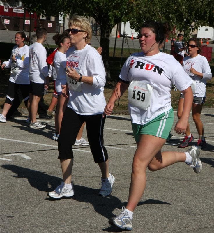 Participants in the annual Hoosiers Outrun Cancer event approach the finish line of the 5k race Saturday morning at Memorial Stadium. Hundreds ran to support and commemorate the lives of those who have been affected by cancer.