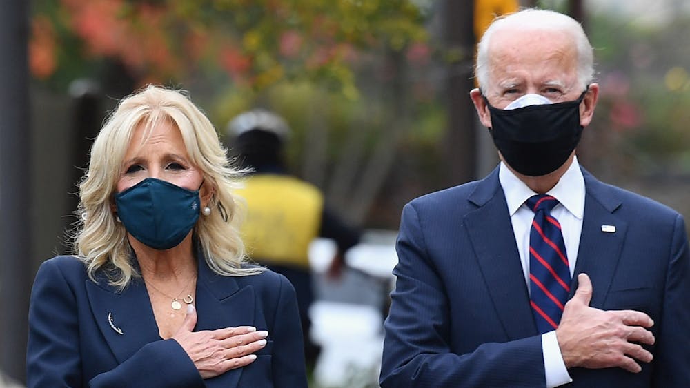President-elect Joe Biden and his wife Jill Biden pay their respects during a Veterans Day stop on Nov. 11, 2020, at the Korean War Memorial Park in Philadelphia. Biden is extending the pause on  student loan repayment through August 31. 