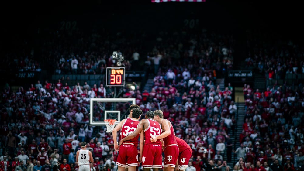 The Indiana team huddles midcourt Dec. 10, 2022 at the MGM Grand Arena in Las Vegas, Nevada. The Hoosiers lost to Arizona 89-75.