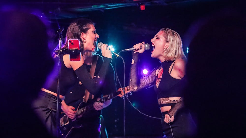 Lead singers Emma Spartz and Julia Rusyniak sing Oct. 31, 2021, at the Bluebird. The first time Spartz and Rusyniak met was two weeks before Six Foot Blonde began as a band. "It's hard for me to perform without her and I think it's vice versa," Rusyniak said of Spartz. "I think a lot of the time people would assume that we were comparing ourselves to each other, competing, but the crazy thing is that it works perfectly."