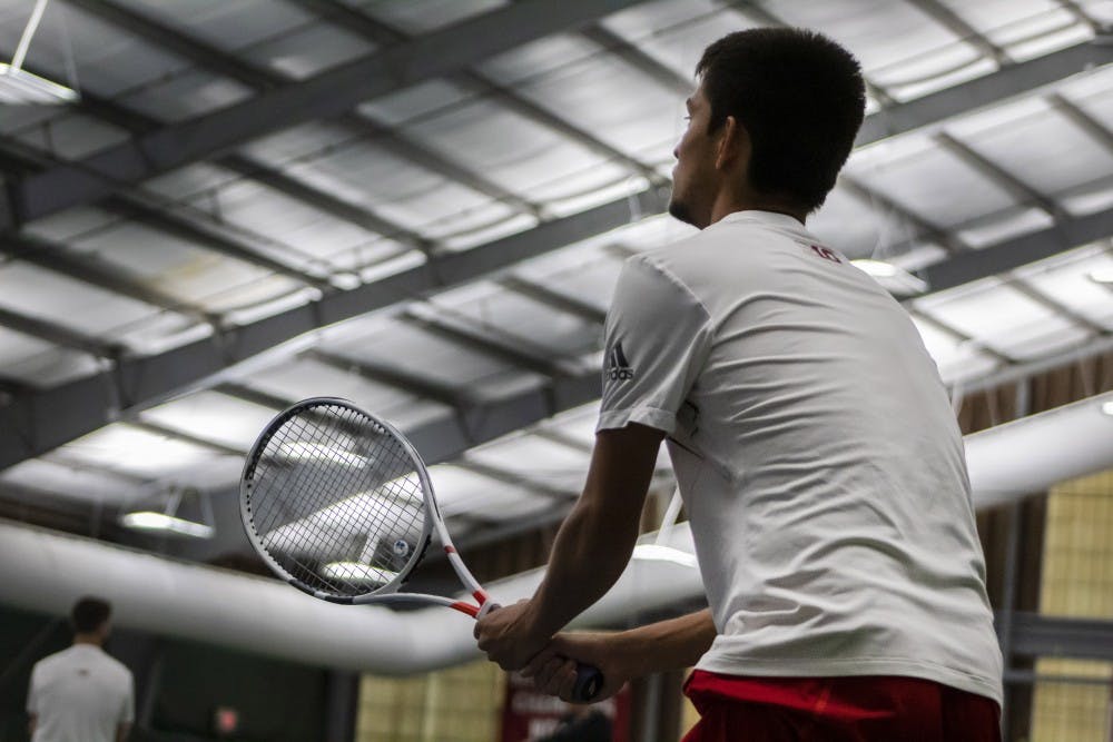 <p>Sophomore Brandon Lam prepares to return a serve April 14 at the IU Tennis Center. IU defeated Saint Louis University, 7-0.</p>