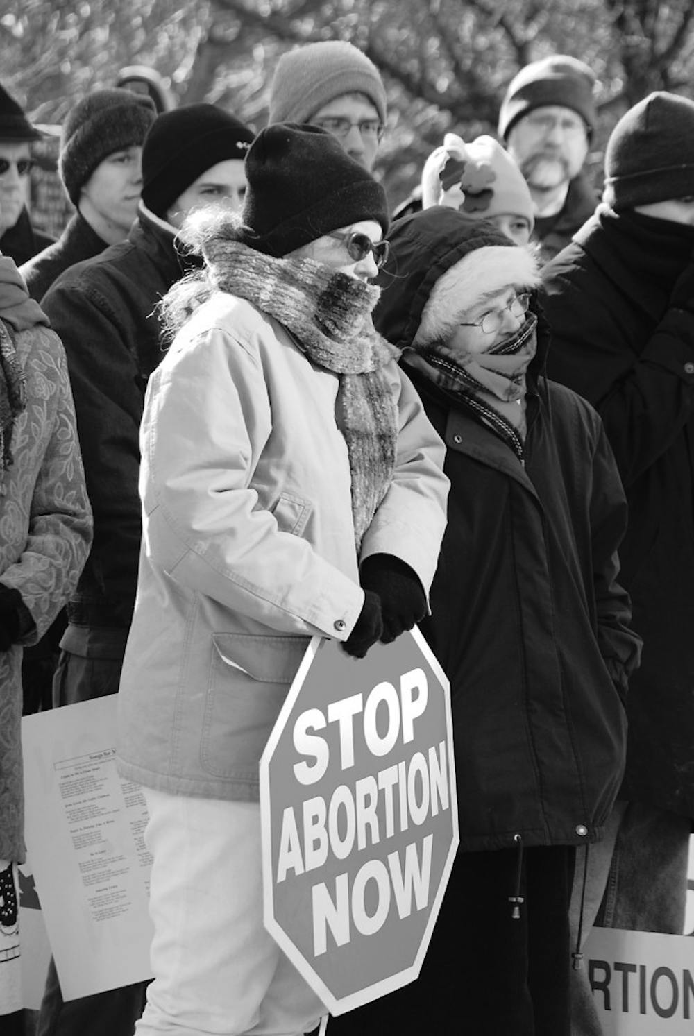 Pro-life protesters rally Sunday afternoon on the lawn of the Monroe County Courthouse to speak against abortion. The protest day was chosen specifically because it was the 35th anniversary of Roe v. Wade.