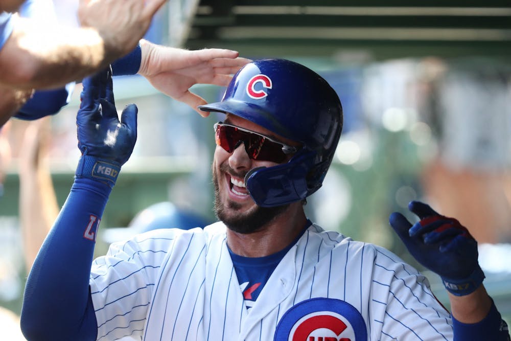 <p>Chicago Cubs third baseman Kris Bryant is congratulated on a three-run home run Sept. 15, 2019, against the Pittsburgh Pirates in the first inning at Wrigley Field. Bryant will play one more year for the Cubs after losing a grievance with the team.</p>