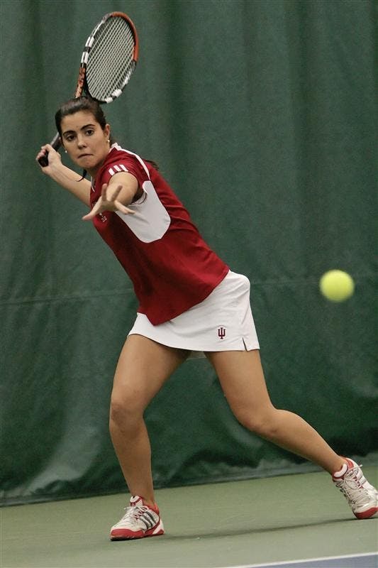 Senior Alba Berdala returns the ball during doubles play Sunday afternoon at the IU Tennis Center. Berdala and teammate freshman Megan Matter defeated Miami University's Brintney Larson/Riekie Honiball 8-5. The Hoosiers won the event 4-3.