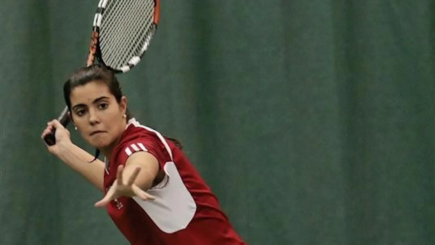 Senior Alba Berdala returns the ball during doubles play Sunday afternoon at the IU Tennis Center. Berdala and teammate freshman Megan Matter defeated Miami University's Brintney Larson/Riekie Honiball 8-5. The Hoosiers won the event 4-3.