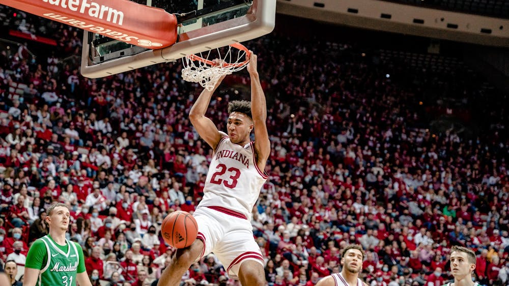 Junior forward Trayce Jackson-Davis dunks the ball Nov. 27, 2021, at Simon Skjodt Assembly Hall during Indiana&#x27;s 90-79 win over Marshall. Jackson-Davis set an Assembly Hall record by scoring 43 points.