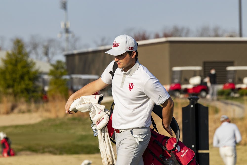 <p>Senior Tate Heintzelman puts on his bag during the Hoosier Collegiate Invitational on April 4 at the Pfau Course. The IU men&#x27;s golf team will be competing at the Robert Kepler Intercollegiate on Saturday and Sunday in Columbus, Ohio.</p>