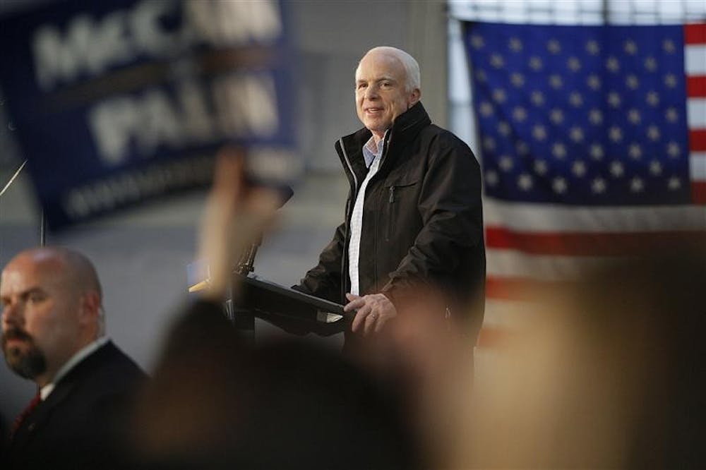 Republican presidential candidate Sen. John McCain, R-Ariz., listens to the cheers of supporters during a campaign rally on Sunday at the University of Scranton in Scranton, Pa.