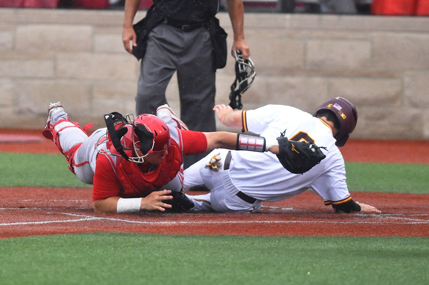 Sophomore catcher Ryan Fineman tries to tag out Minnesota’s Terrin Vavra at home plate on May 24, 2017. Vavra scored one of Minnesota’s 5 runs in their 5-4 win over the Hoosiers.