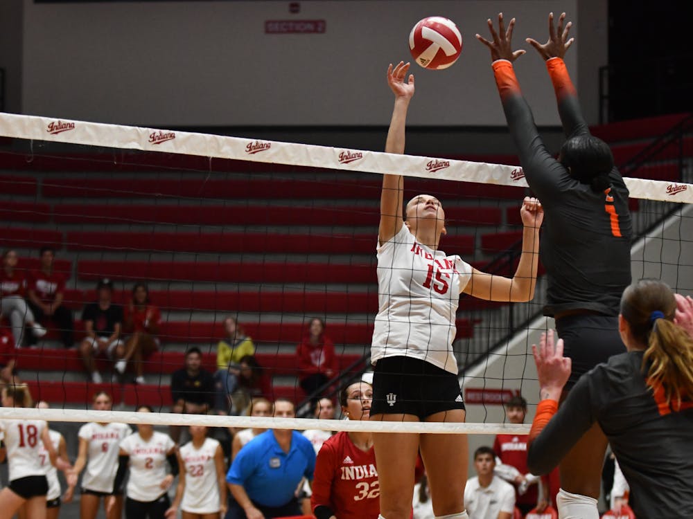 Senior middle blocker Savannah Kjolhede tips the ball over the net Sept. 20, 2023, against Illinois at Wilkinson Hall in Bloomington. Kjolhede had 12 blocks and two aces.