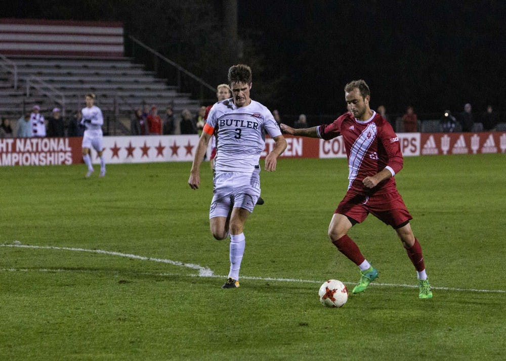 <p>Sophomore midfielder Spencer Glass goes to kick the ball toward Butler's goal during IU's game Oct. 16 at Bill Armstrong Stadium. Glass's kick resulted in a goal to finish the game. IU defeated Butler, 3-0.&nbsp;</p>
