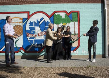 Mayor John Hamilton and mural artist Eva Allen cut the ribbon to officially unveil the mural. The mural in Peoples Park has been in progress since March, but has only recently been finished.&nbsp;