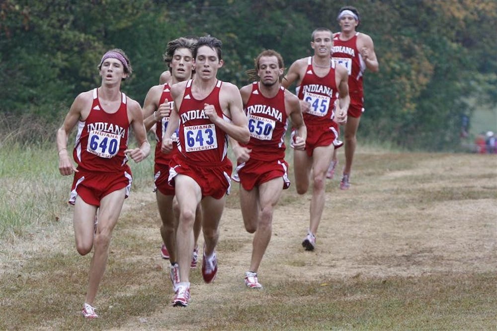 A pack of Hoosier runners, led by redshirt freshman Andrew Bayer, sprint toward the finish line at the Indiana Open on Sept. 11 at the IU cross country course.