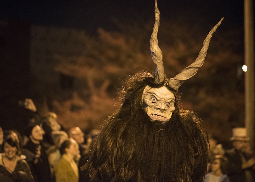 Dozens of people dressed up in Krampus costumes paraded down Madison Street for the Krampus Rampage and Baazar in December 2017. This year's Krampus Bazaar will begin at 5 p.m. Dec. 1 at the Showers Common on 401 N. Morton St.