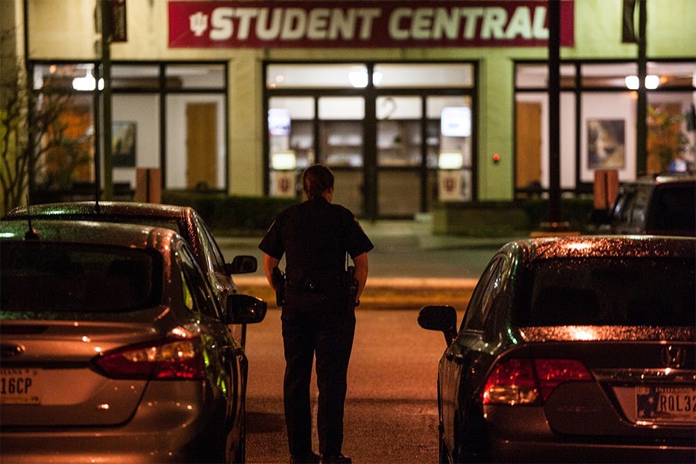 An IUPD officer patrols outside the Student Central on Union building Thursday night. A suspicious package was reported by a custodian after being found outside the main entrance to the building. Indiana State Police later confirmed that package contained books and was of no threat.