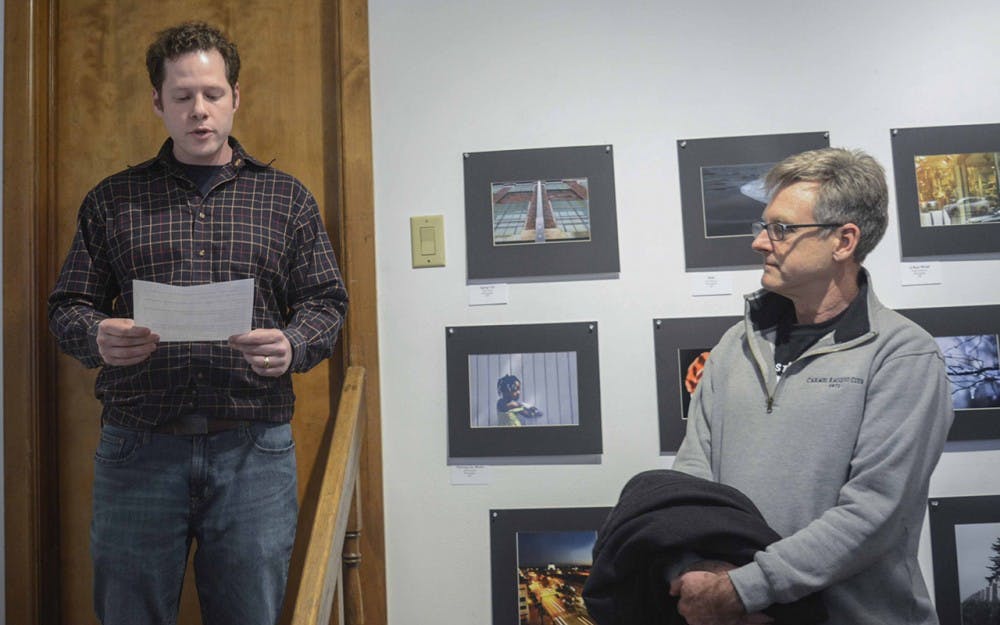 Gabriel Colman (left), the owner and curator of The Venue, Fine Art & Gifts, are announcing the award winners during the Juried Arts student show at The Venue, Jan 29. 