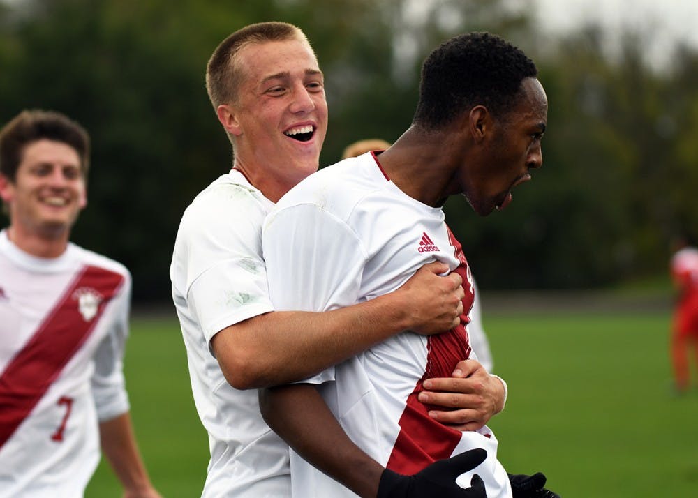 Freshman forward Griffin Dorsey celebrates with freshman forward Mason Toye after assisting on Toye's first half-goal against Ohio State on Oct. 15 at Bill Armstrong Stadium. Per an IU athletics release Friday, Toye will forgo his final three seasons of eligibility with IU after signing a Generation adidas deal with Major League Soccer.&nbsp;