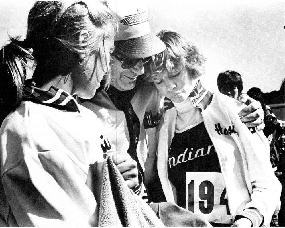 Men's track coach Sam Bell'sencouragement keeps things running smoothlyfor Leigh Ann Kincaid (right) and Cindy Brownduring the tournament. The two women latersuffered injuries in the Big Ten Championship,in which IU finished seventh