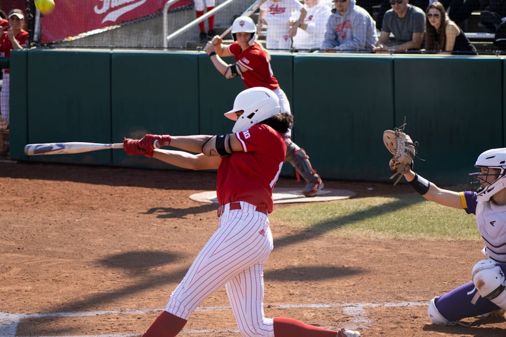 <p>Junior catcher Desiree Dufek hits the ball against Western Illinois on March 5, 2022. Indiana will travel to Wisconsin over the weekend for a three-game road series.<br/><br/></p>