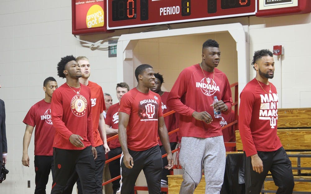 IU men's basketball players walk onto the court to watch new head coach Archie Miller&nbsp;speak to the public for the first time at his introductory press conference on Monday, March 27.