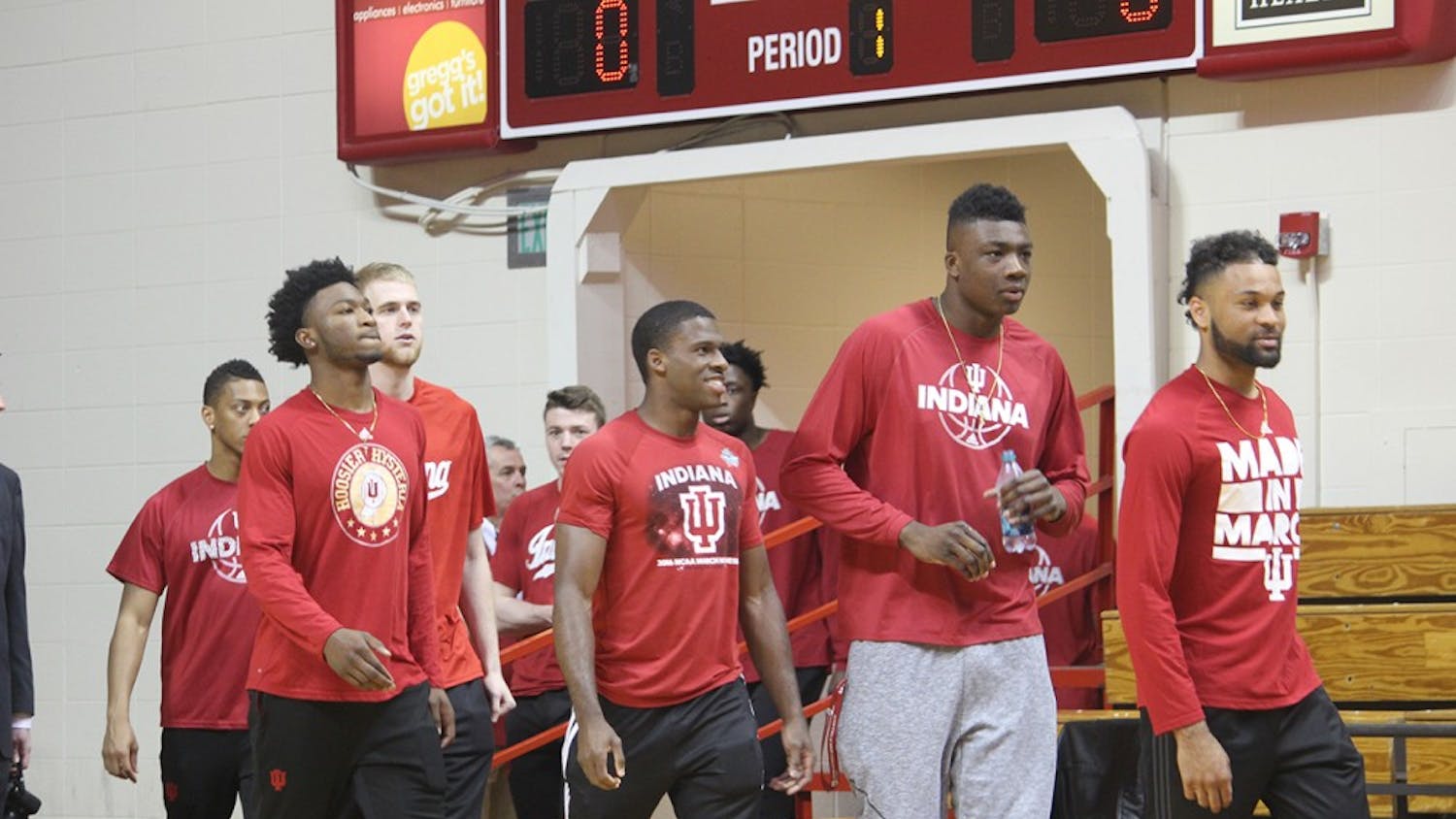 IU men's basketball players walk onto the court to watch new head coach Archie Miller&nbsp;speak to the public for the first time at his introductory press conference on Monday, March 27.