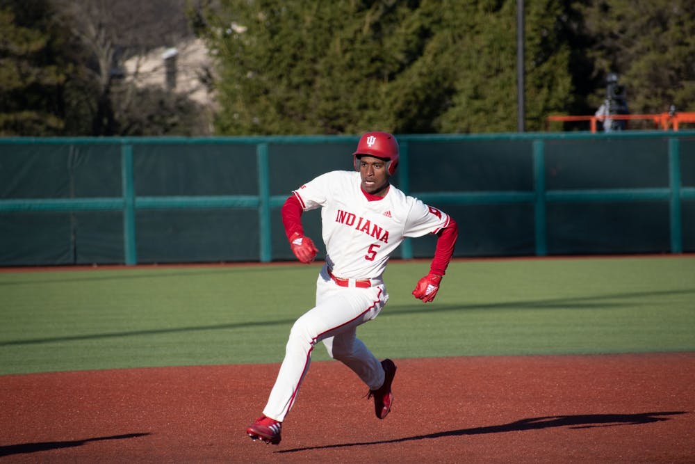 <p>Freshman outfielder Devin Taylor runs to third base February 28, 2023, against Butler University at Bart Kaufman Field in Bloomington, Indiana. Taylor and sophomore pitch Luke Sinnard both won weekly awards after series sweep against Morehead State University.</p>