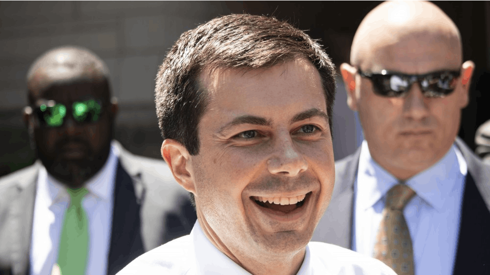 South Bend Mayor Pete Buttigieg smiles as he greets spectators outside June 11 at the IU Auditorium. People waited for Buttigieg after he gave his speech to IU at 11:00 a.m.