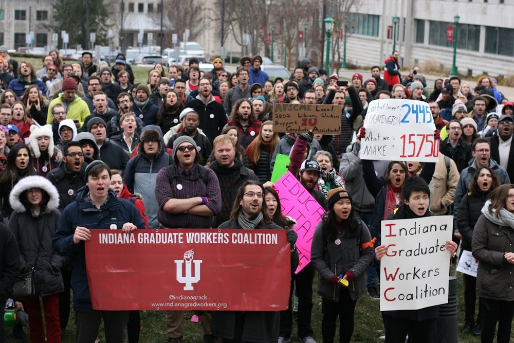 <p>IU graduate students and supporters march in a protest against mandatory fees Jan. 28, 2020. The IU School of Education announced it will waive unremittable fees, which usually total about $1000 per year for graduate students, starting in Fall of 2021.</p>