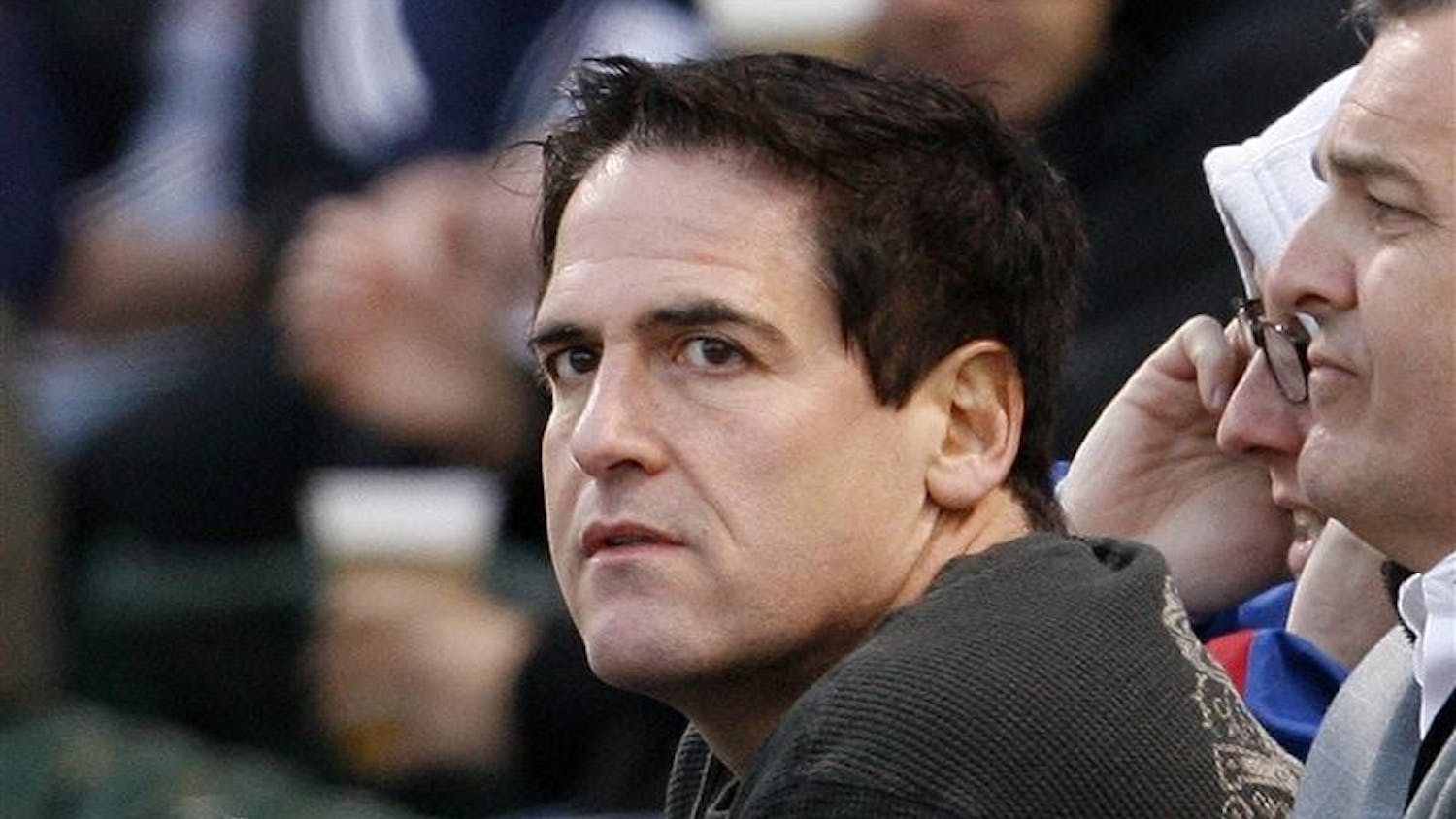 In this April 30, 2008 file photo, Mark Cuban, owner of the Dallas Mavericks NBA basketball team, watches the Chicago Cubs play the Milwaukee Brewers in the first inning of a baseball game in Chicago. Since buying the Dallas Mavericks eight years ago, Mark Cuban has been called a lot of unpleasant things: NBA nuisance, meddling owner, even a bad dancer. Now Cuban is facing the most serious allegation yet - insider trading. 