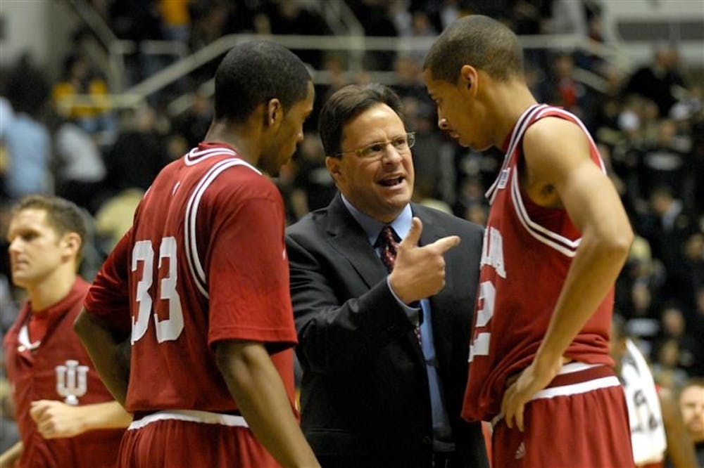 After failing to get a last second shot off before halftime, IU coach Tom Crean discusses the play with Devan Dumes (left) and Verdell Jones (right) before heading into the locker room.