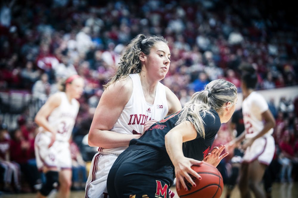 Senior forward MacKenzie Holmes plays defense under the basket Jan. 12, 2023 at Simon Skjodt Assembly Hall in Bloomington, Indiana. The Hoosiers travel to Ann Arbor to face Michigan on Monday night.