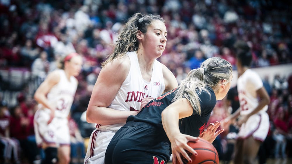 Senior forward MacKenzie Holmes plays defense under the basket Jan. 12, 2023 at Simon Skjodt Assembly Hall in Bloomington, Indiana. The Hoosiers travel to Ann Arbor to face Michigan on Monday night.