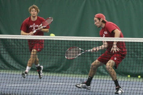 Colin Thompson - IDSIU's top doubles team of Phillip Eilers and Dara McLoughlin hits a return shot during their match with Indiana State on January 25th at the IU Tennis Center.  The duo won their match 8-7 (7-3) in a 7-0 team sweep of the Sycamores.