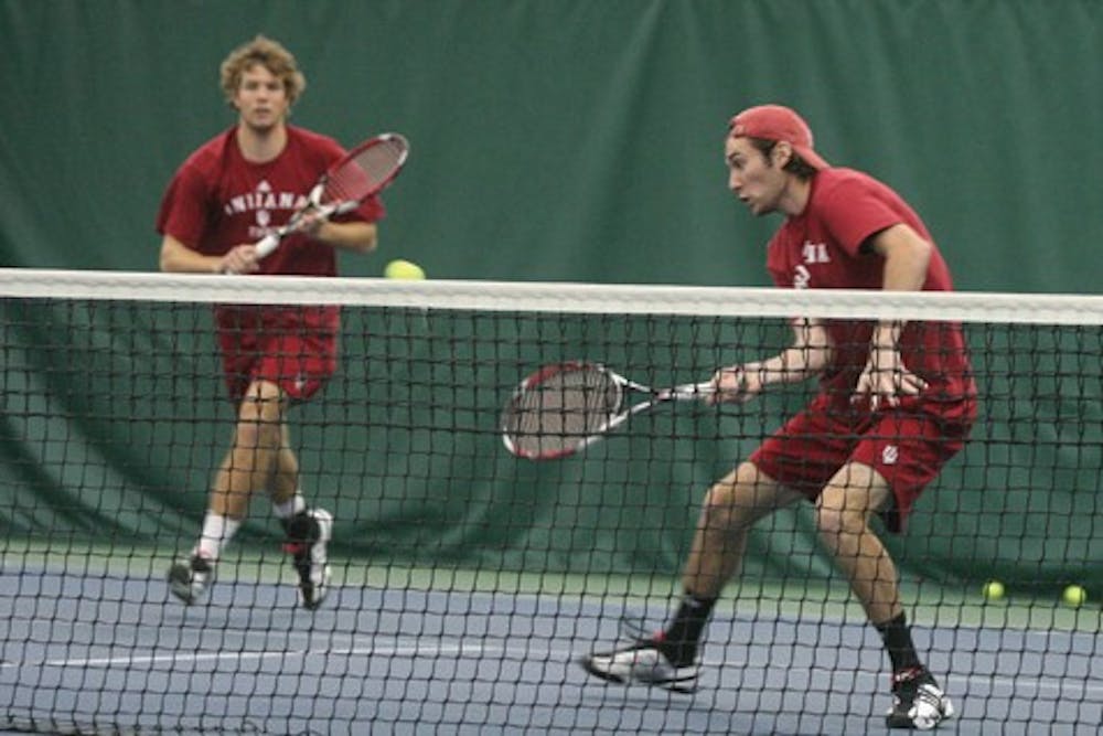 Colin Thompson - IDS

IU's top doubles team of Phillip Eilers and Dara McLoughlin hits a return shot during their match with Indiana State on January 25th at the IU Tennis Center.  The duo won their match 8-7 (7-3) in a 7-0 team sweep of the Sycamores.