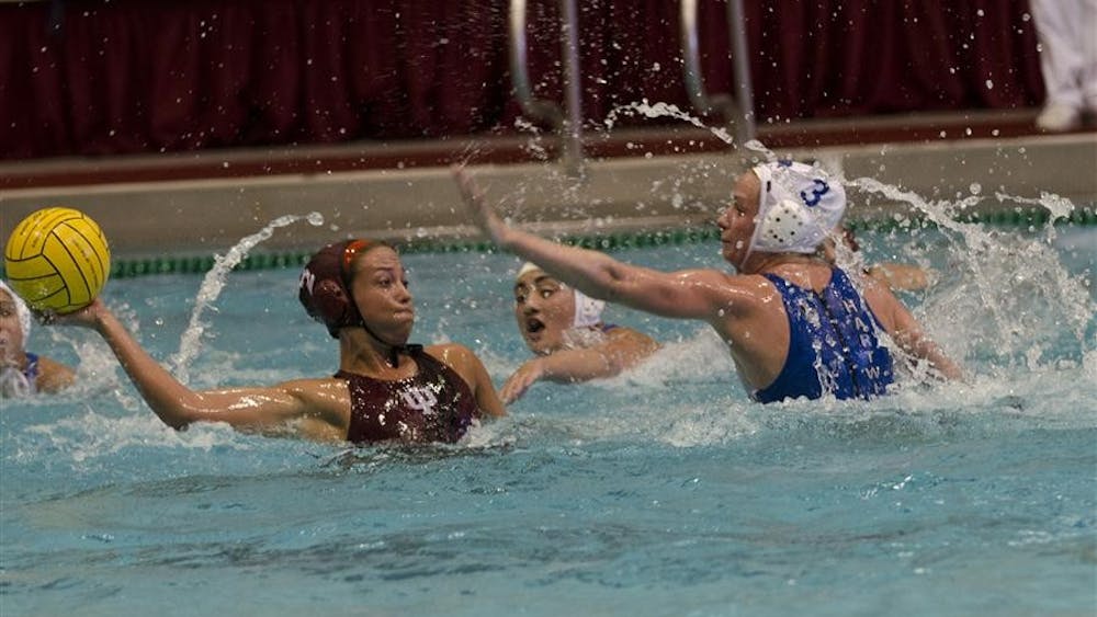 Senior utility Lauren Wyckoff prepares to pass the ball during the Hoosiers' 10-9 victory against Hartwick at the Counsilman/Billingsley Aquatic Center.