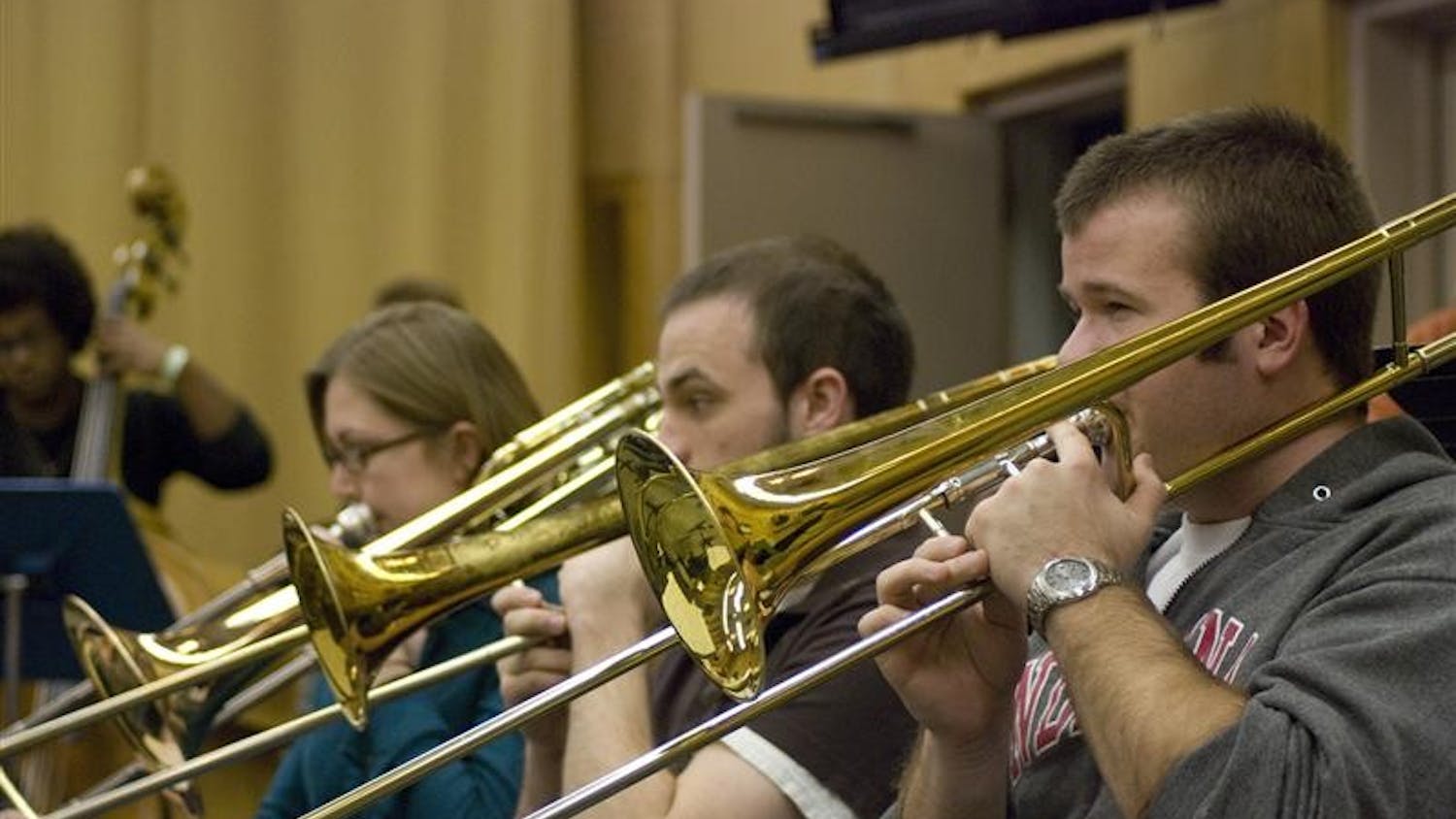 Trombonists Heather Gibson, Simon Wood and Russell Ballenger practice for Big Band Extravaganza on April 15 in the Jacobs School of Music. Brent Wallarab, leader of this group, and David Baker will showcase their bands at 8 p.m. at the Musical Arts Center.