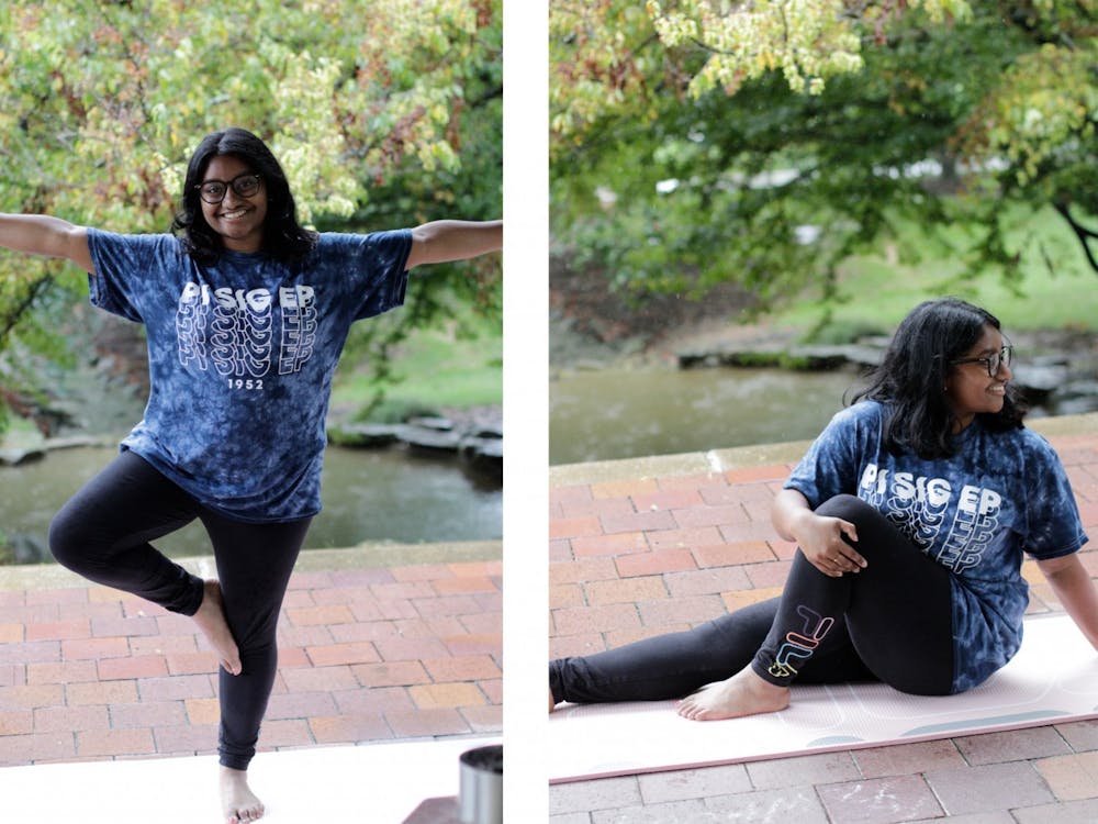 Sophomore Haripriya Jalluri demonstrates yoga poses learned in School of Public Health I190: Yoga 1 on Sept. 22, 2021, outside of Herman B Wells Library. The class takes place twice a week for 50 minutes.