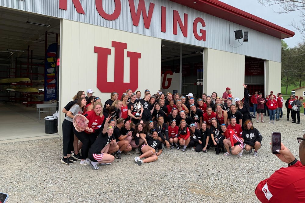 Members of the Indiana rowing team celebrate April 30, 2022, at Lake Lemon. The Hoosiers ended the season with a fourth place finish in the conference.