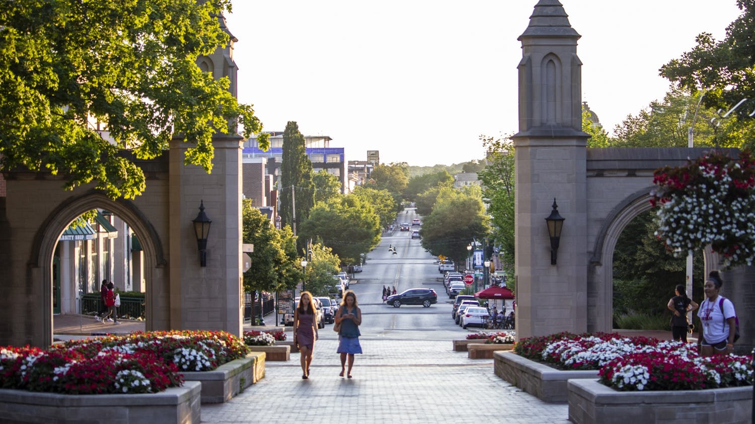 People walk through the Sample Gates on June 27, 2018, near Franklin Hall. IU campuses may no longer require standardized test scores in the admissions process.