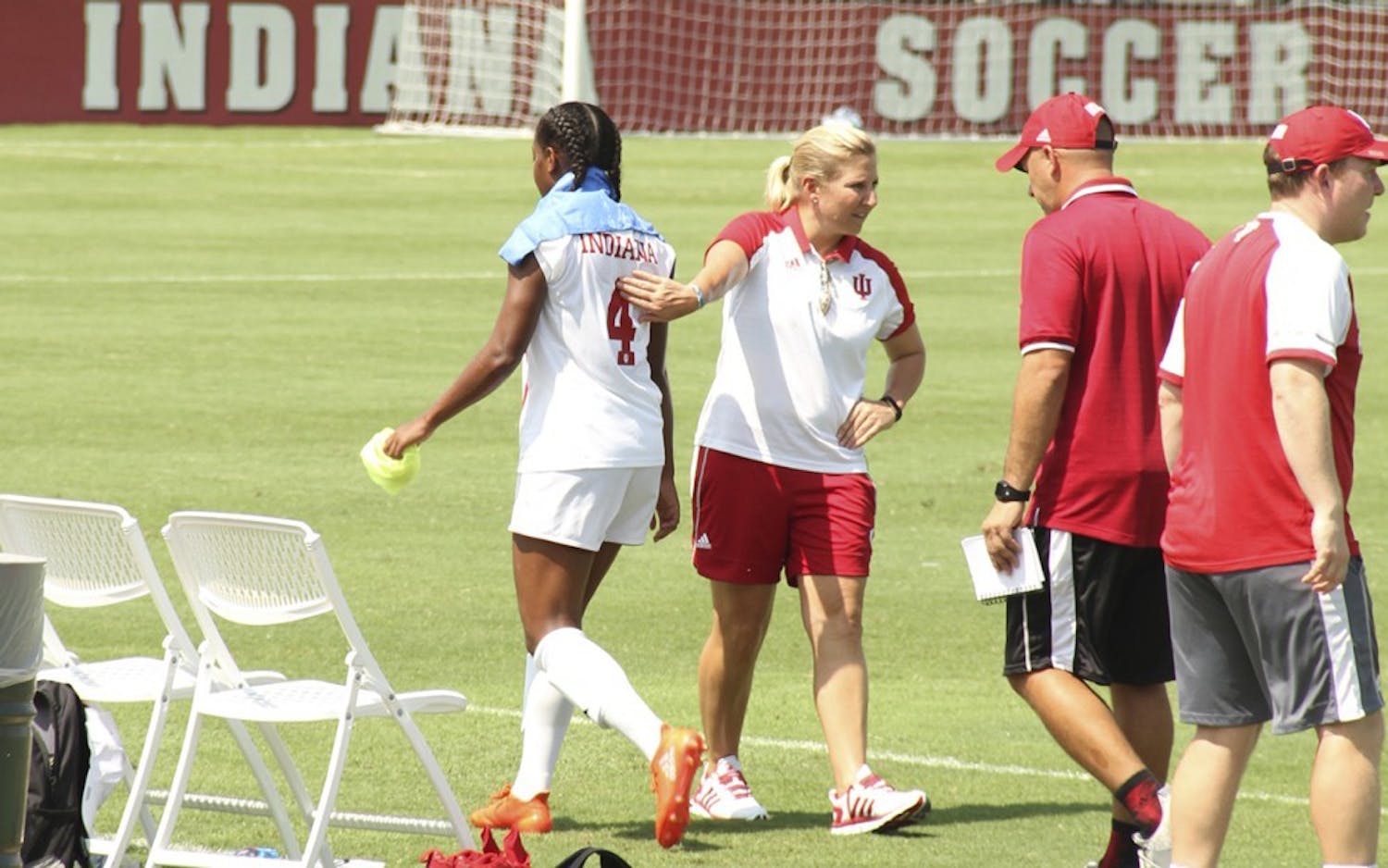 Former IU women's soccer Coach Amy Berbary pats Mykayla Brown on the back after a game Aug. 28, 2016 at Bill Armstrong Stadium. IU athletics announced Thursday that Berbary's contract would not be renewed.