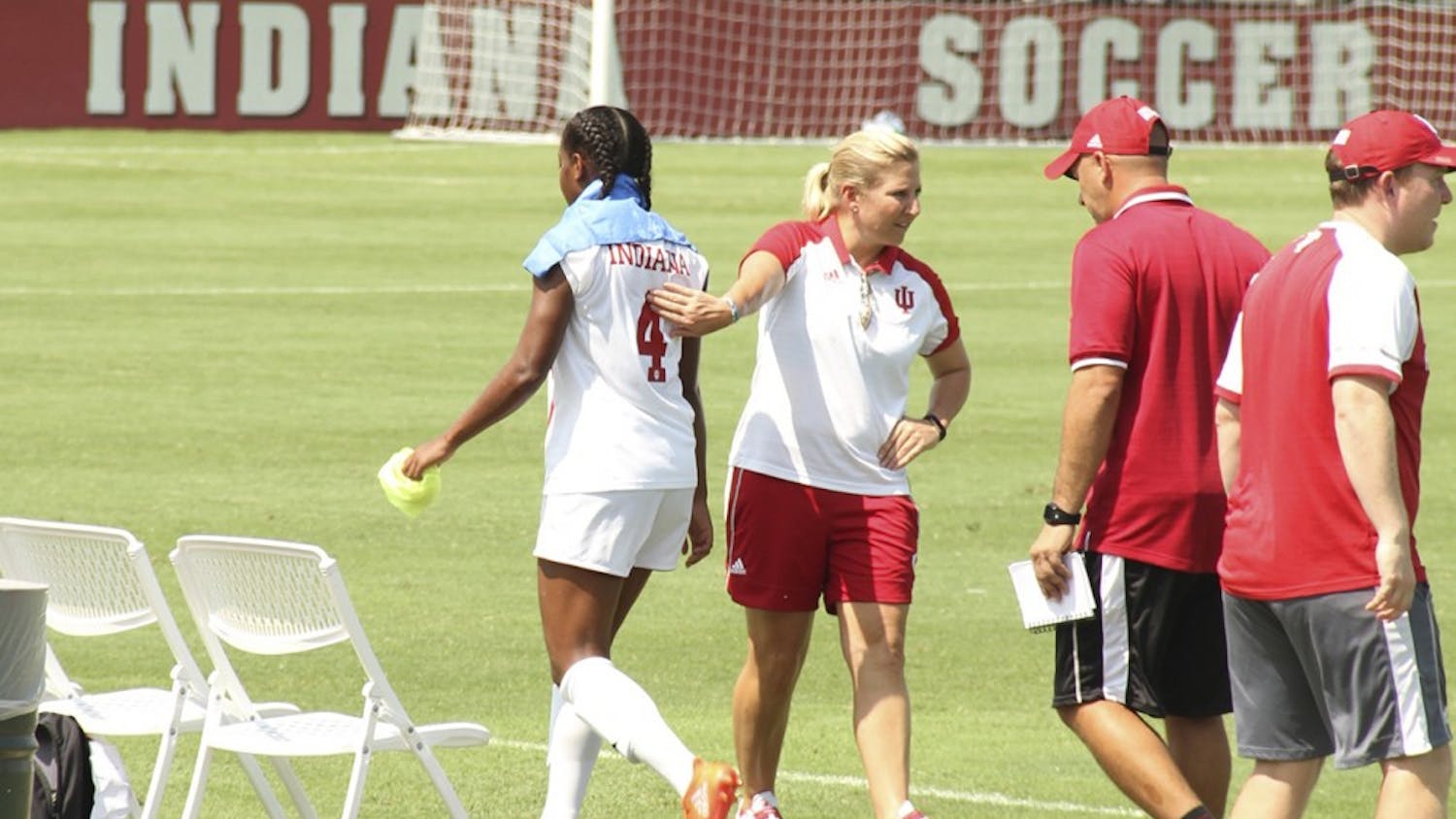 Former IU women's soccer Coach Amy Berbary pats Mykayla Brown on the back after a game Aug. 28, 2016 at Bill Armstrong Stadium. IU athletics announced Thursday that Berbary's contract would not be renewed.